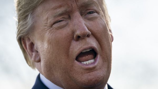U.S. President Donald Trump speaks to reporters on the South Lawn of the White House as he returns on March 3, 2020 in Washington, DC. The president was returning from a trip to the National Institutes of Health in Bethesda, Maryland where he visited the vaccine research center there as the global threat from the coronavirus looms large. Drew Angerer/Getty Images/AFP Drew Angerer / GETTY IMAGES NORTH AMERICA / AFP