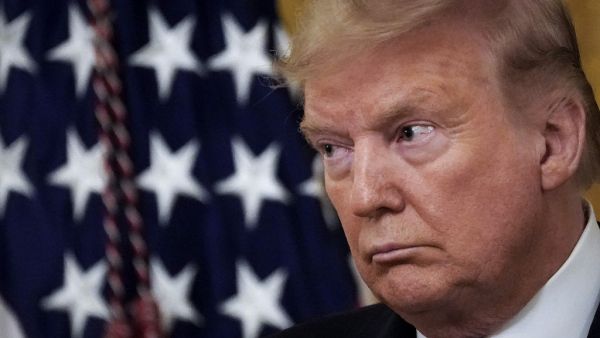 U.S. President Donald Trump look on during a ceremony to present the Presidential Medal of Freedom to retired four-star Army general Jack Keane in the East Room of the White House March 10, 2020 in Washington, DC. Gen. Keane currently works as an analyst on Fox News. Drew Angerer/Getty Images/AFP Drew Angerer / GETTY IMAGES NORTH AMERICA / AFP