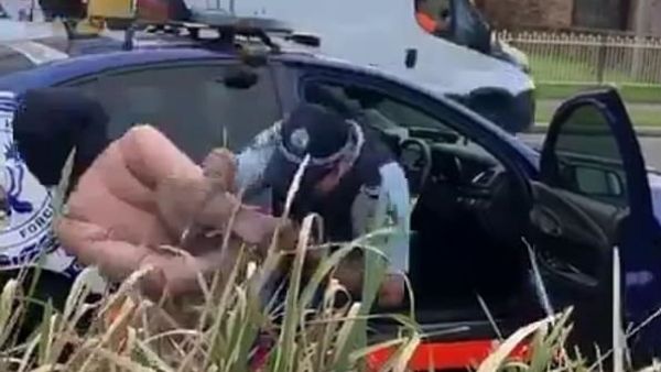 She was placed under arrest just after 5pm on Friday but resisted requests to get in the officer's car and spat in his face twice (Facebook)