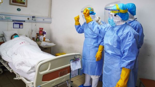 A PATIENT WITH CORONAVIRUS IN AN ISOLATION WARD AT A HOSPITAL IN CHINA, 28 JANUARY 2020 (PHOTO BY STR/AFP VIA GETTY IMAGES)