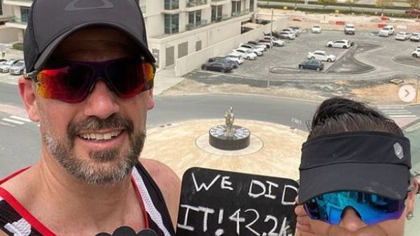 South African couple who ran a marathon on the balcony of their Dubai apartment (Twitter)