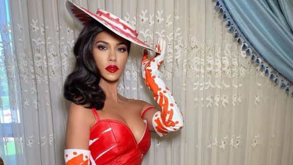 Kourtney was seen wearing a black face mask and shades (source: @kourtneykardash Instagram)