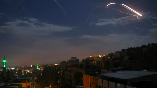 Syrian air defence batteries responding to what the Syrian state media said were Israeli missiles targeting Damascus, in a picture taken early on January 21st, 2019 (STR / AFP)