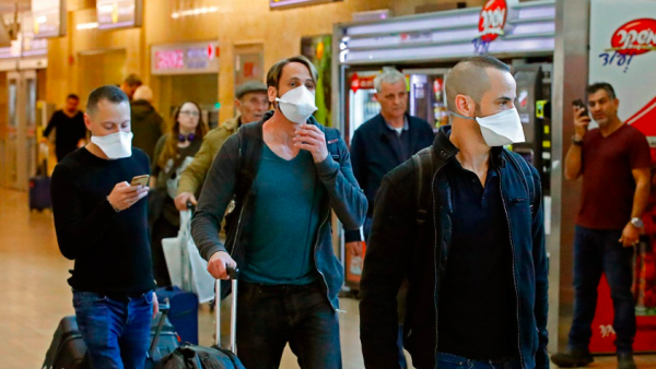 Returning Israelis from Europe face a 14-day self-isolation (AFP File Photo)