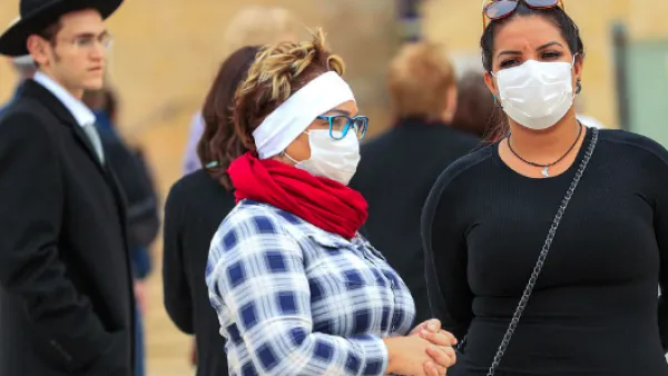 Israel Women visiting Jerusalem’s nearly deserted after Israel imposed some of the world's tightest restrictions to contain COVID-19 coronavirus disease AFP/File