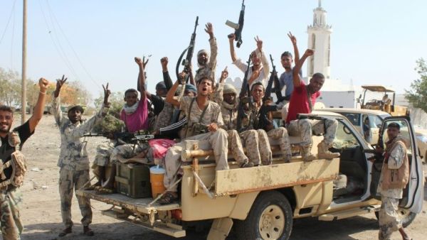 Forces loyal to the Saudi-backed Yemeni president cheer on a road in Abyan province as they take part in an operation to drive Al-Qaeda fighters out of the southern provincial capital, on April 23, 2016. (AFP)