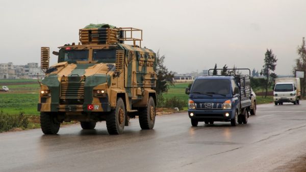 A Turkish military convoy drives on a highway linking Idlib to the Syrian Bab al-Hawa border crossing with Turkey on March 31, 2020. Mohammed AL-RIFAI / AFP