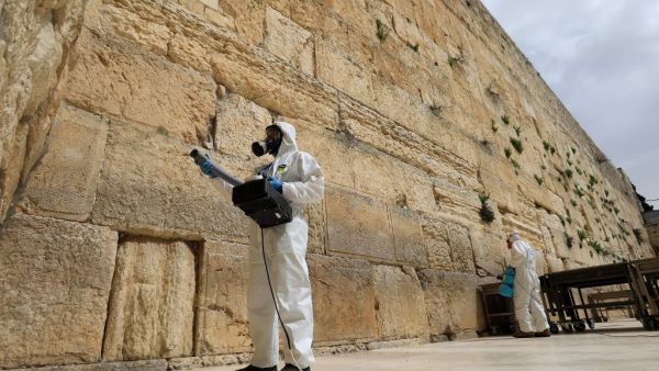 Workers sanitise the Western Wall, the most holy site where Jews can pray on March 31, 2020 against the spread of the coronavirus COVID-19 in Jerusalem. Emmanuel DUNAND / AFP