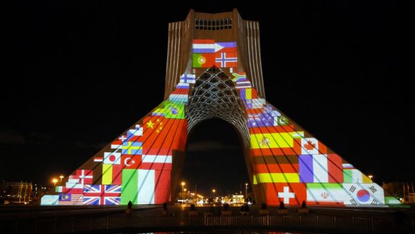 Iran's Azadi (Freedom) Tower is lit up with flags and messages of hope in solidarity with all the countries affected by the COVID-19 coronavirus pandemic, in Tehran on March 31, 2020. AFP