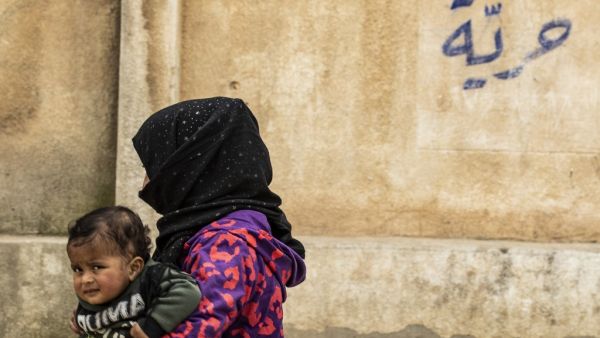 A Syrian child displaced from Ras al-Ain, a border town controlled by Turkey and its Syrian proxies, is pictured in a school turned into a shelter in the city of Hasakeh on April 5, 2020 in northeastern Syria. AFP