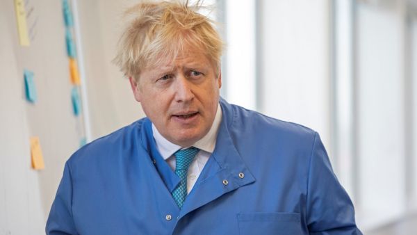 In this file photo taken on March 06, 2020 Britain's Prime Minister Boris Johnson visits to the Mologic Laboratory in the Bedford technology Park, north of London . Britain's Prime Minister Boris Johnson appeared to be on the road to recovery as Downing Street said the Prime Minister had returned to the ward at St Thomas' Hospital after spending three nights in the intensive care unit.  Jack Hill / POOL / AFP