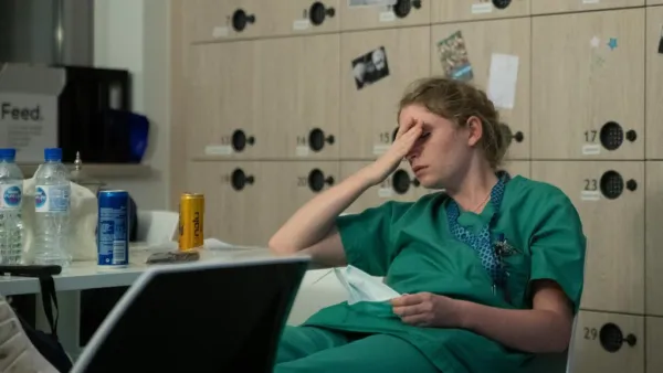Mathilde Dumont, a 27-year-old nurse, reacts to tiredness early on April 11, 2020, during her night shift in the intensive care unit exclusively for COVID-19 patients at the Ixelles Hospital in Brussels, amid the COVID-19 pandemic, caused by the novel coronavirus. Aris Oikonomou / AFP