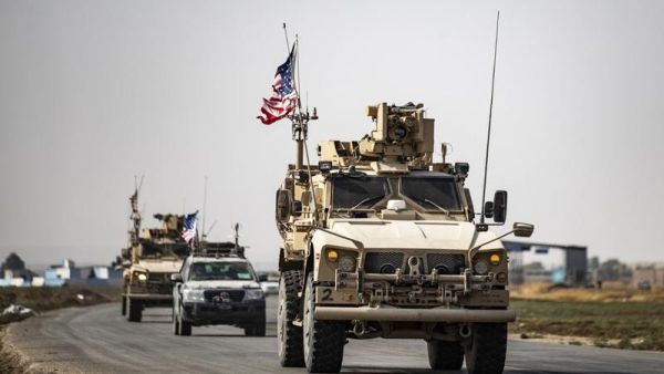 US military vehicles drive on a road after US forces pulled out of their Tal Tamr base in Northern Syrian on October 20, 2019 (PHOTO / SOULEIMAN / AFP)