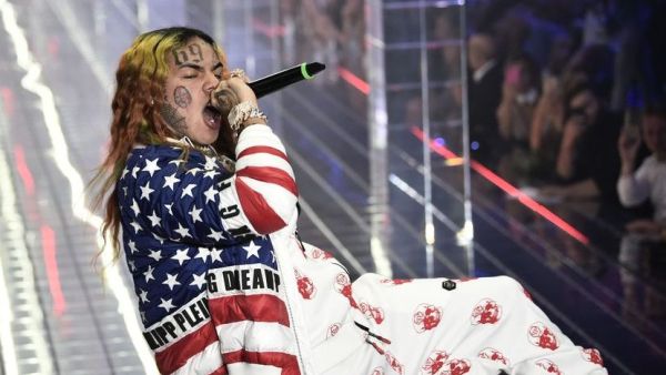 In this file photo taken on September 21, 2018 US rapper Tekashi 6ix9ine performs during the Philipp Plein fashion showw as part of the Women's Spring/Summer 2019 fashion week in Milan. MARCO BERTORELLO / AFP via Getty Images