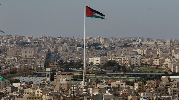 A picture taken on April 27, 2020, shows the Jordanian flying waving in the wind over the capital Amman, during the Muslim holy month of Ramadan. Khalil MAZRAAWI / AFP