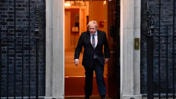 Britain's Prime Minister Boris Johnson walks of 10 Downing Street in central London on April 30, 2020, to participate in a national "clap for carers" to show thanks for the work of Britain's NHS (National Health Service) workers and other frontline medical staff around the country as they battle with the novel coronavirus pandemic, in the doorway of ˜Britain is "past the peak" of its coronavirus outbreak, Prime Minister Boris Johnson said Thursday, despite recording another 674 deaths in the last 24 hours, 