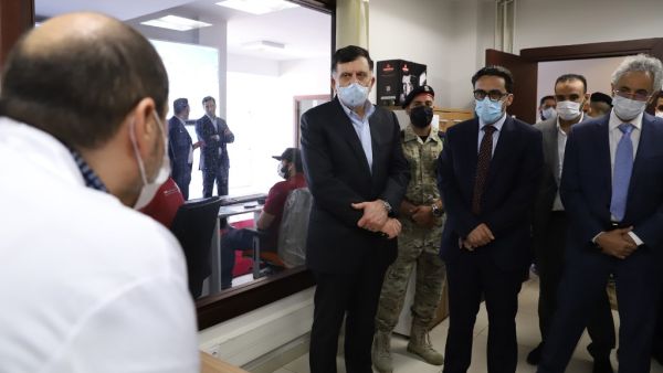 Fayez al-Sarraj (C), Prime Minister of Libya's UN-recognised Government of National Accord (GNA), visits the COVID-19 coronavirus response centre in the capital Tripoli on May 4, 2020. AFP