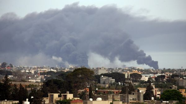 Smoke fumes rise above buildings in the Libyan capital Tripoli, during reported shelling by strongman Khalifa Haftar's forces, on May 9, 2020  Mahmud TURKIA / AFP