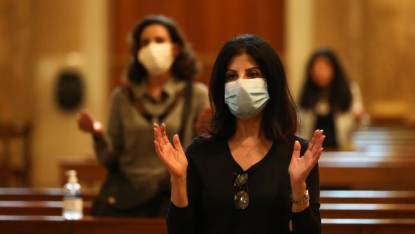 Christian worshippers maintain social distancing as they attend a Sunday mass following the reopening of Saint George Maronite Church in the Lebanese capital Beirut amid the ongoing COVID-19 pandemic, on May 10, 2020. ANWAR AMRO / AFP