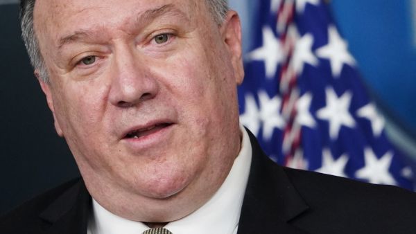 In this file photo US Secretary of State Mike Pompeo speaks during the daily briefing on the novel coronavirus, COVID-19, in the Brady Briefing Room at the White House on April 8, 2020, in Washington, DC. US Secretary of State Mike Pompeo welcomed a power-sharing deal signed Sunday by Afghan President Ashraf Ghani and his rival Abdullah Abdullah, pressing for a political settlement to end surging militant violence. "Secretary Pompeo congratulated the two leaders for reaching an agreement on inclusive govern