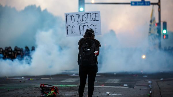 Clashes broke out and major cities imposed curfews as America began another night of unrest Saturday with angry demonstrators ignoring warnings from President Donald Trump that his government would stop violent protests over police brutality "cold." Kerem Yucel / AFP