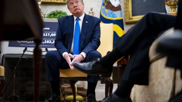 .S. President Donald Trump talks to reporters while meeting with Iowa Governor Kim Reynolds in the Oval Office at the White House as he continues to promote re-opening business during the coronavirus pandemic May 06, 2020 in Washington. (POOL / GETTY IMAGES NORTH AMERICA / Getty Images via AFP)