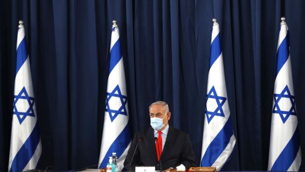 Israeli Prime Minister Benjamin Netanyahu, wearing a protective face mask, chairs the weekly cabinet meeting in Jerusalem on May 31, 2020. RONEN ZVULUN / POOL / AFP