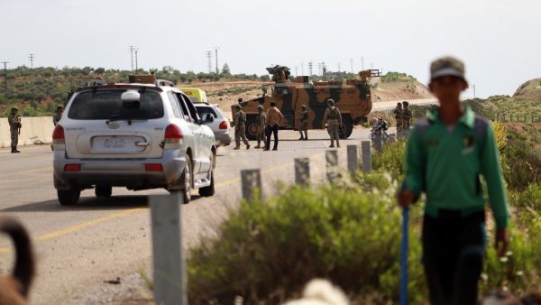 A shepherd boy leads his flock near Turkish soldiers standing outside an armoured vehicle part of a joint Turkish-Russian military patrol along the M4 highway in Ariha in the rebel-held northwestern Syrian province of Idlib on June 2, 2020. Abdulaziz KETAZ / AFP A shepherd boy leads his flock near Turkish soldiers standing outside an armoured vehicle part of a joint Turkish-Russian military patrol along the M4 highway in Ariha in the rebel-held northwestern Syrian province of Idlib on June 2, 2020. Abdulaziz KETAZ / AFP