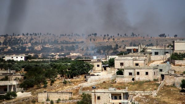 This picture taken on June 4, 2020 shows smoke plumes rising following shelling by pro-Syrian government forces in the town of Banin, north of Maaret al-Numan in Syria's northwestern Idlib province. Abdulaziz KETAZ / AFP