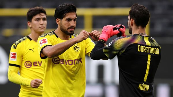 رومان بوركي (يمين) وإيمري تشان يحتفلان بفوز دورتموند على هيرتا برلين