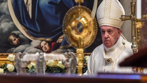 Pope Francis leaves at the end of a Holy Mass on the Solemnity of the Most Holy Body and Blood of Christ, on June 14, 2020 at St. Peter's Basilica in The Vatican, as the city-state eases its lockdown aimed at curbing the spread of the COVID-19 infection, caused by the novel coronavirus. Tiziana FABI / AFP