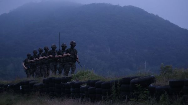 South Korean marines patrol on the South Korea-controlled island of Yeonpyeong near the 'northern limit line' sea boundary with North Korea on June 17, 2020. North Korea threatened June 17 to bolster its military presence in and around the Demilitarized Zone, a day after blowing up its liaison office with the South, prompting sharp criticism from Seoul. YONHAP / AFP