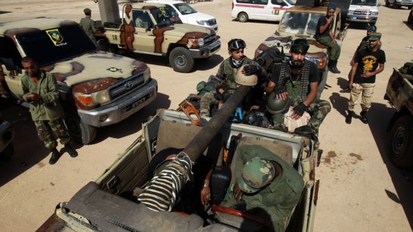 Members of the self-proclaimed eastern Libyan National Army (LNA) special forces gather in the city of Benghazi, on their way to reportedly back up fellow LNA fighters on the frontline west of the city of Sirte, facing forces loyal to the UN-recognised Government of National Accord (GNA), on June 18, 2020. The resurgent GNA has vowed to push on for Sirte, late Libyan leader Moamer Kadhafi's hometown and the last major settlement before the traditional boundary between western Libya and Haftar's stronghold i