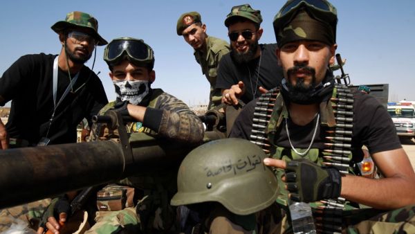 Members of the self-proclaimed eastern Libyan National Army (LNA) special forces gather in the city of Benghazi, on their way to reportedly back up fellow LNA fighters on the frontline west of the city of Sirte, facing forces loyal to the UN-recognised Government of National Accord (GNA), on June 18, 2020. The resurgent GNA has vowed to push on for Sirte, late Libyan leader Moamer Kadhafi's hometown and the last major settlement before the traditional boundary between western Libya and Haftar's stronghold i