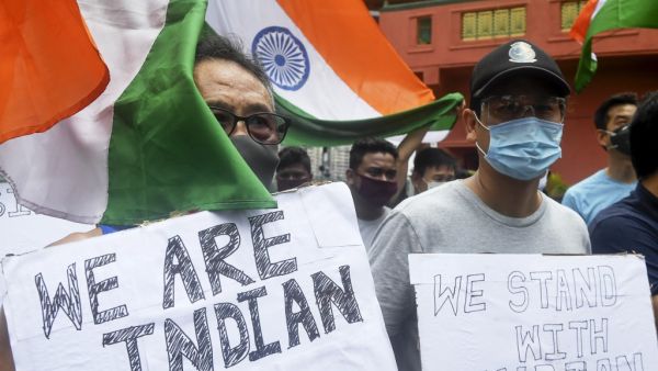 Indian citizens of Chinese origin hold placards and Indian national flags shouting slogans in support of the Indian army during an anti-China demonstration in Kolkata on June 20, 2020. China has freed 10 Indian soldiers seized in a high-altitude border clash in the Himalayas which left at least 20 Indian soldiers dead, media reports said on June 19. Dibyangshu SARKAR / AFP