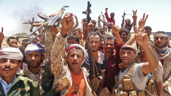 In this file photo taken on May 11, 2020, fighters from of the Southern Transitional Council (STC) gesture following clashes with Saudi-backed government forces in the Sheikh Salim area in the southern Abyan province. On top of war and the coronavirus pandemic, Yemen faces looming economic disaster as a crisis gripping its main benefactor Saudi Arabia dents remittances and leaves state coffers running dry. Nabil HASAN / AFP