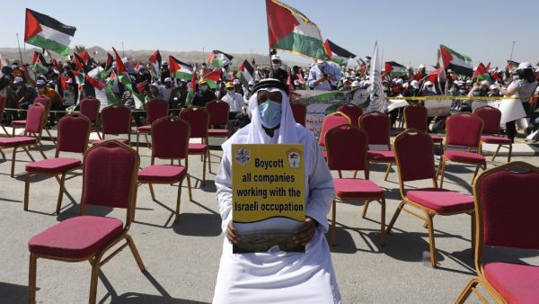 Palestinians participate in a big rally to protest against Israel's plan to annex parts of the occupied West Bank, in Jericho on June 22, 2020. Israel intends to annex West Bank settlements and the Jordan Valley, as proposed by US President Donald Trump, with initial steps slated to begin from July 1. ABBAS MOMANI / AFP