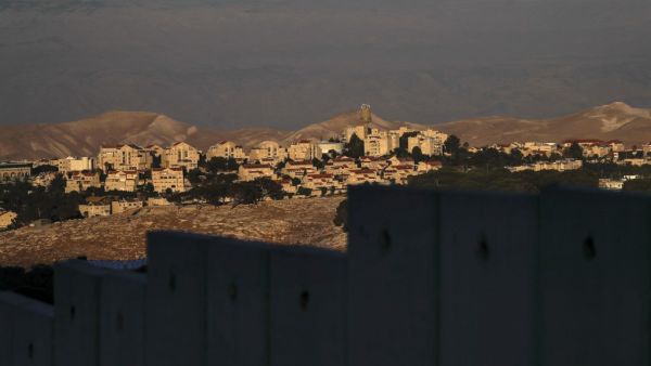A picture taken from east Jerusalem behind Israel's controversial separation barrier shows the Israeli settlement of Maale Adumim in the occupied West Bank on June 22, 2020. AHMAD GHARABLI / AFP
