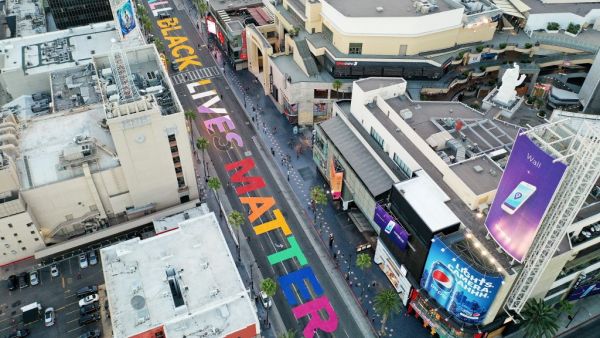 A photo taken with a drone shows people painting an 'All Black Lives Matter' mural on Hollywood Boulevard in Hollywood, California. (AFP/File)