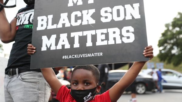 The site has become a place of remembrance for Mr. Brooks, who was killed by police while fleeing after a struggle during a field sobriety test in the Wendy's parking lot. Joe Raedle/Getty Images/AFP