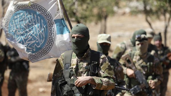 HTS has opted for a pragmatic approach toward Ankara after allowing the circulation of Turkish lira as an alternative to the devalued Syrian currency. (AFP)