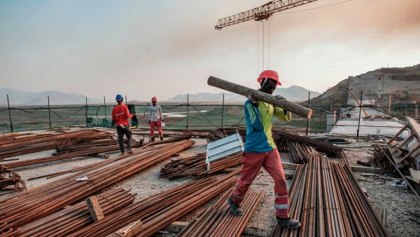 Workers at the Grand Ethiopian Renaissance Dam in Ethiopia on 26 December 2019 [EDUARDO SOTERAS/AFP/Getty Images]