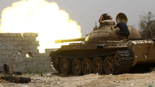 Forces loyal to the UN-recognised Government of National Accord (GNA) open tank fire from their position in the al-Sawani area south of the Libyan capital Tripoli during clashes with Haftar forces, June 13, 2019. (AFP)
