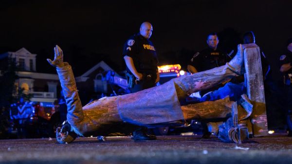 A statue of Confederate States president Jefferson Davis lies on the street after protesters pulled it down in Richmond, Virginia, on June 10, 2020. (AFP)