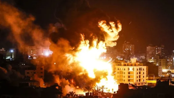 Fire and smoke below above buildings in Gaza City during reported Israeli strikes on March 25, 2019. (AFP)