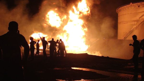 Fire blazes from the Aden oil refinery following a reported shelling attack by Houthi rebels in the embattled southern Yemeni city of Aden on July 13, 2015 [SALEH AL-OBEIDI/AFP/Getty Images]