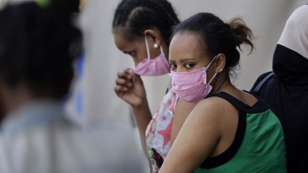 Ethiopian domestic workers wait outside their country's consulate to register for repatriation in Beirut, on 18 May 2020 (AFP)