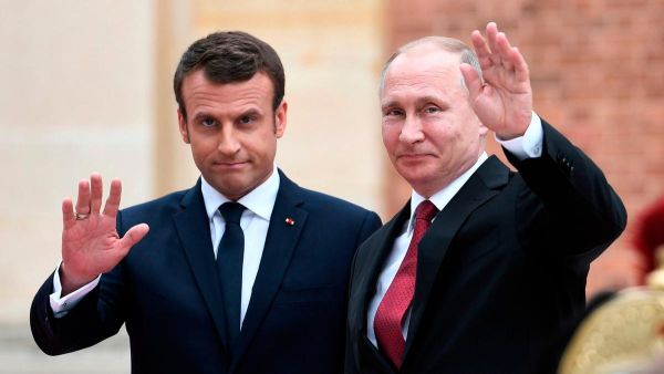 French President Emmanuel Macron with Russian leader Vladimir Putin. AFP