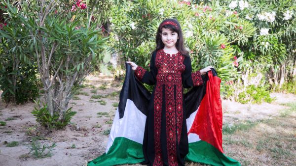 A Palestinian little girl wears a traditional dress. (Shutterstock/ File Photo)