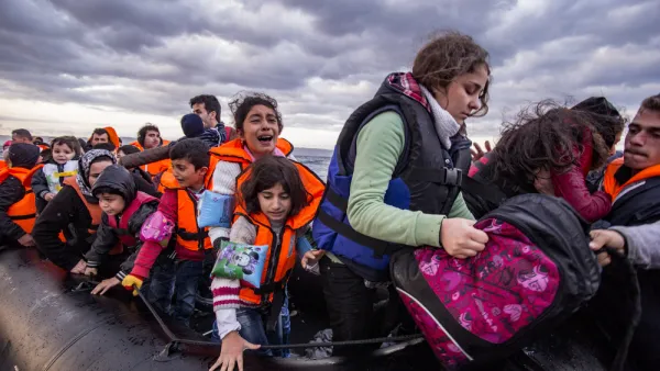 Syrian migrants / refugees arrive from Turkey on boat through sea with cold water near Molyvos, Lesbos. (Shutterstock/ File Photo)